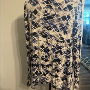 Long sleeve white, blue and black top.